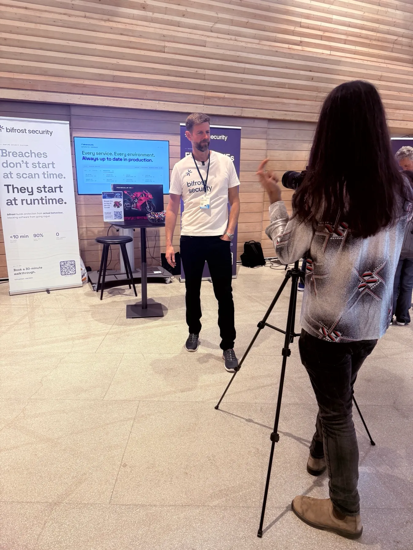 Hannes from bifrost being filmed at the booth during the event.